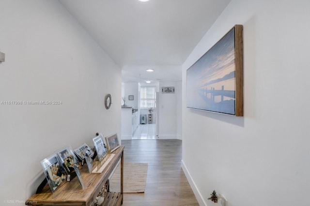 corridor featuring wood-type flooring