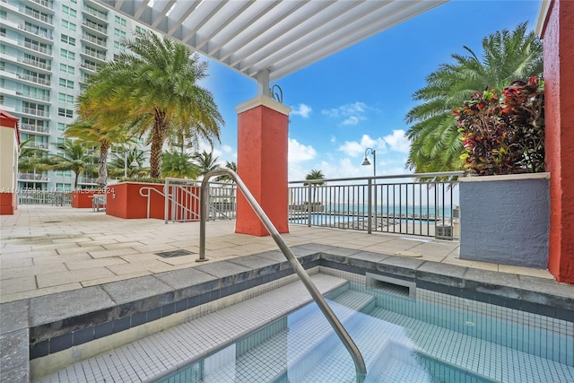 view of pool featuring a water view