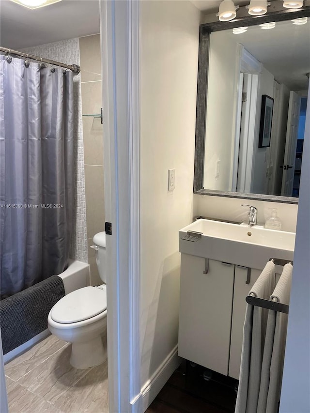 full bathroom with vanity, tile patterned floors, toilet, and shower / bath combination with curtain