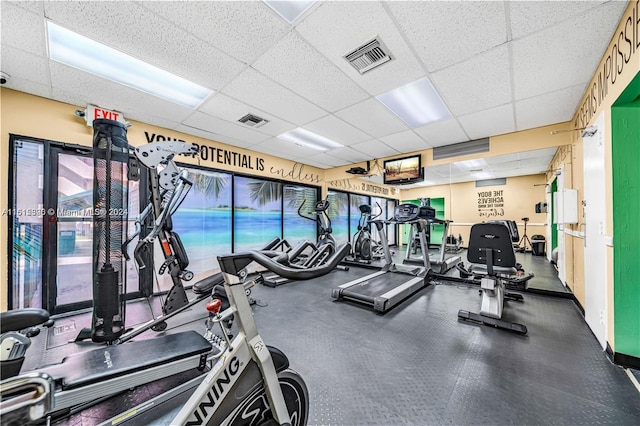 workout area with a drop ceiling