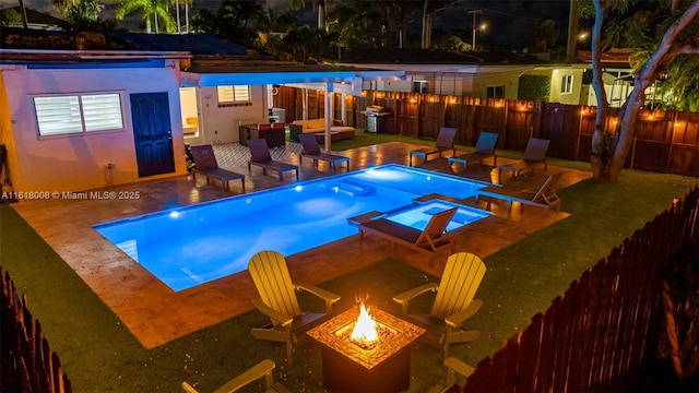 view of pool featuring area for grilling, a patio, and a fire pit