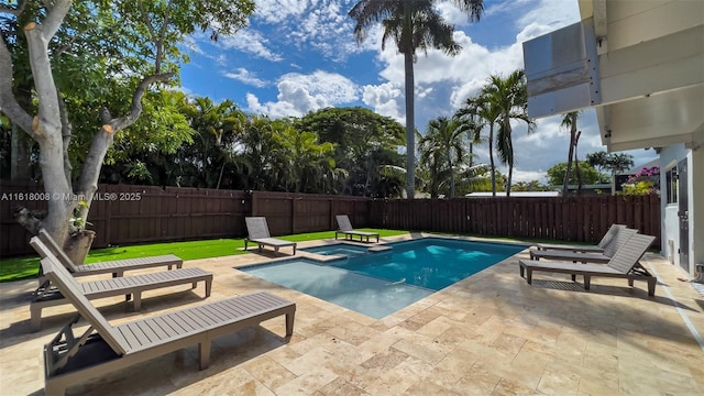 view of pool with a patio area and an in ground hot tub