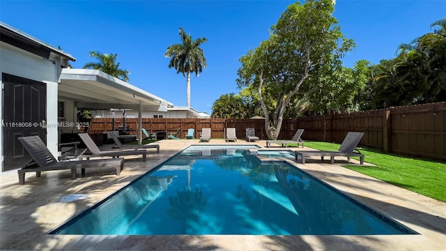 view of pool featuring a patio area and a hot tub