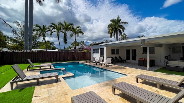 view of swimming pool with outdoor lounge area and a patio area