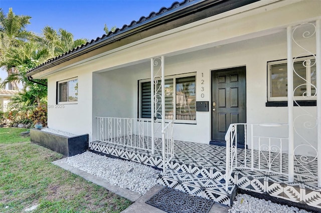 doorway to property with a porch