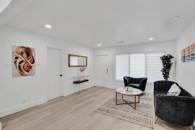 sitting room featuring light hardwood / wood-style flooring