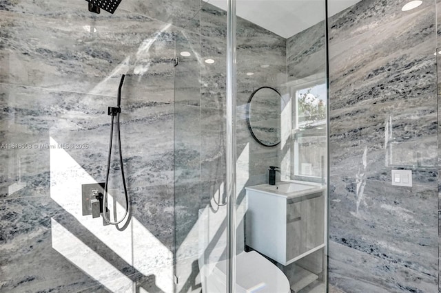 bathroom with vaulted ceiling, sink, and a shower with door