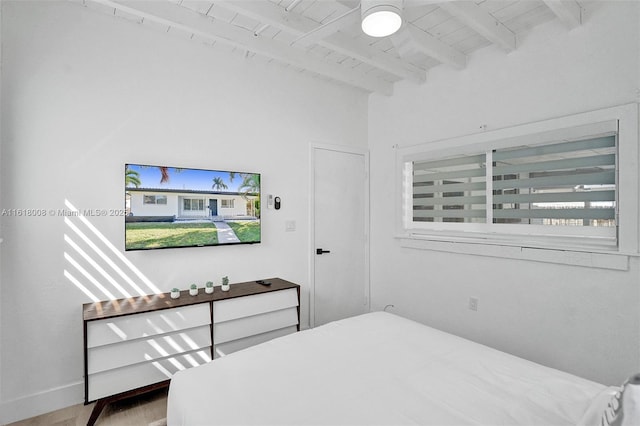 bedroom with beam ceiling and wooden ceiling