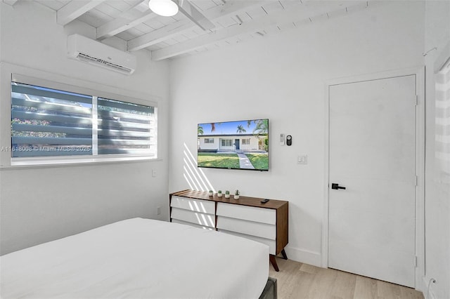 bedroom with beamed ceiling, a wall mounted air conditioner, wood ceiling, and light hardwood / wood-style floors