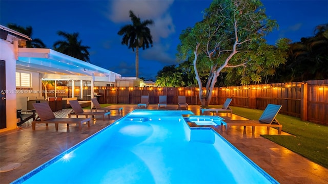 view of swimming pool with a patio