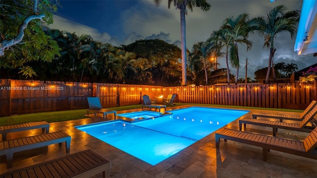 view of swimming pool with an in ground hot tub and a patio area