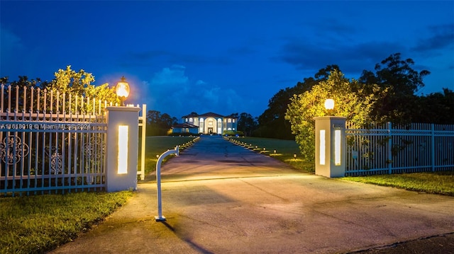 view of gate featuring a yard