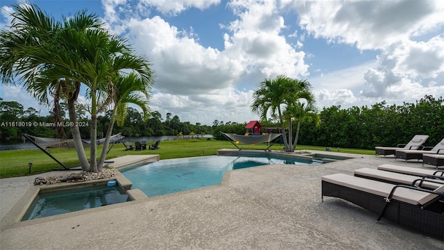 view of pool featuring a yard, an in ground hot tub, and a patio