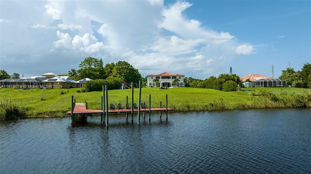 dock area with a yard, a water view, and a gazebo