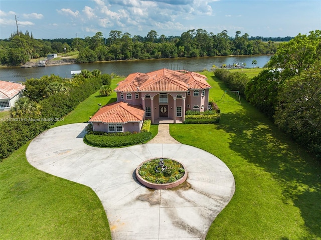 view of front of property with a front yard and a water view