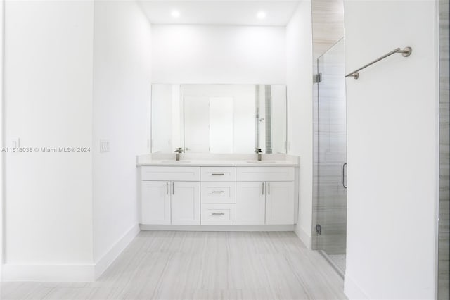 bathroom with vanity and walk in shower