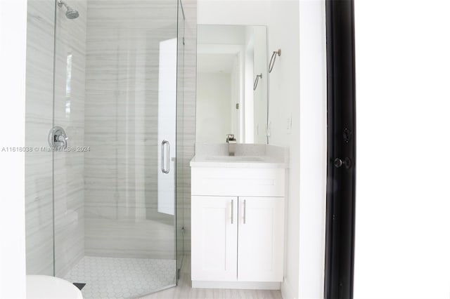 bathroom with vanity and walk in shower