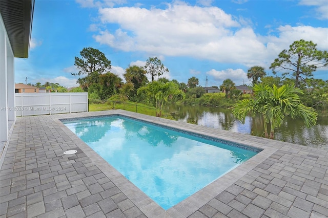 view of swimming pool with a water view