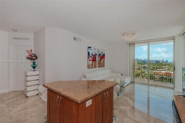 kitchen with a center island and expansive windows