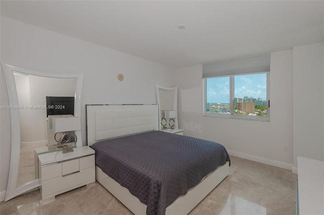 bedroom with light tile patterned flooring