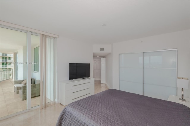 bedroom featuring expansive windows and a closet