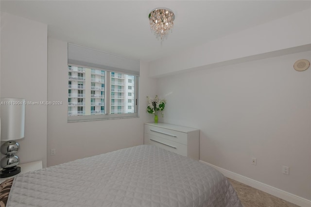 bedroom featuring an inviting chandelier