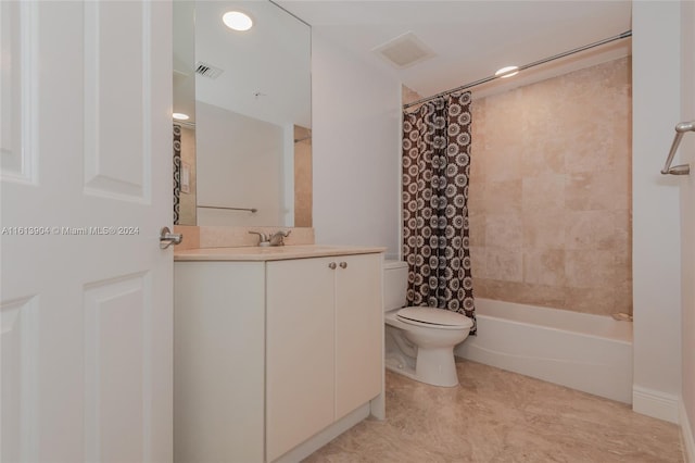 full bathroom featuring shower / tub combo with curtain, vanity, and toilet