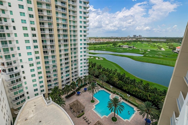 view of swimming pool with a water view and a patio area