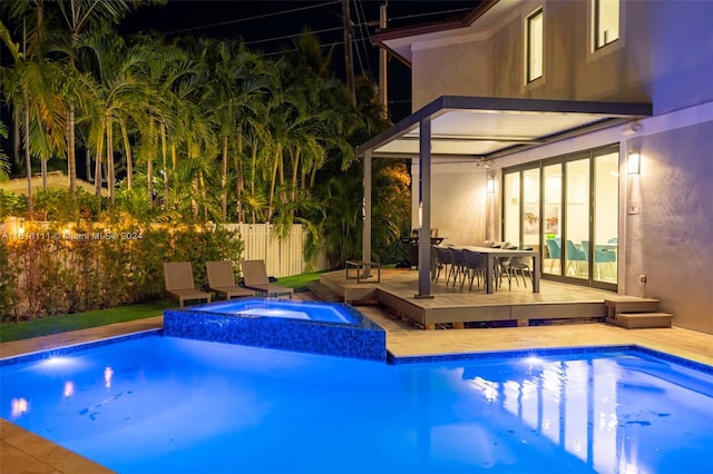 view of pool featuring an in ground hot tub