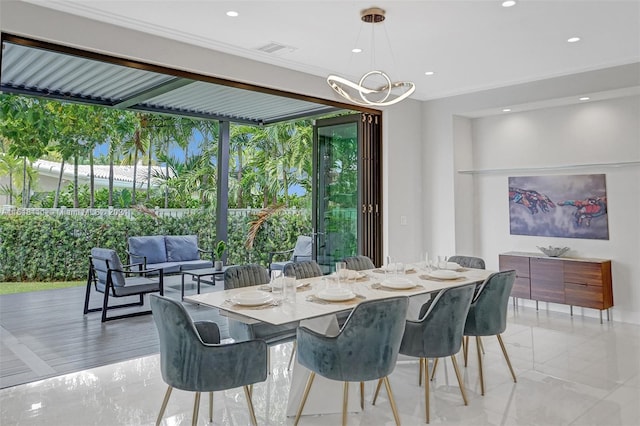 dining area with a chandelier and a healthy amount of sunlight