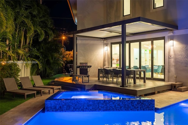 view of pool with an in ground hot tub and a patio