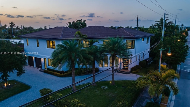 view of front of property with a lawn