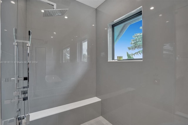 bathroom featuring a tile shower