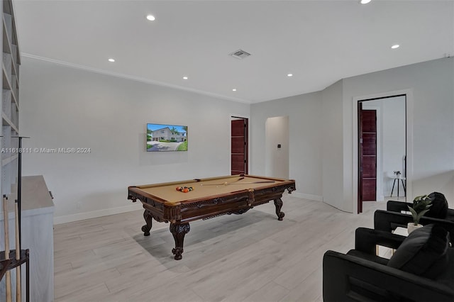 game room with pool table, crown molding, and light hardwood / wood-style flooring