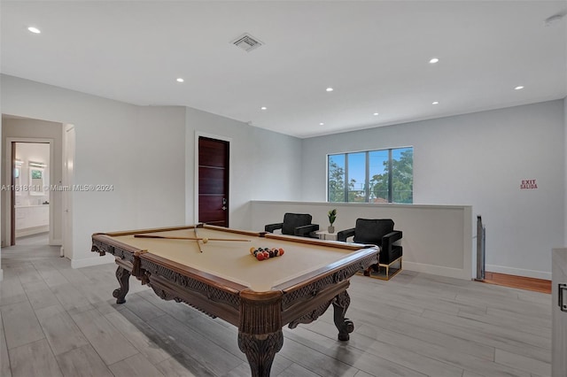 playroom with light hardwood / wood-style floors and billiards