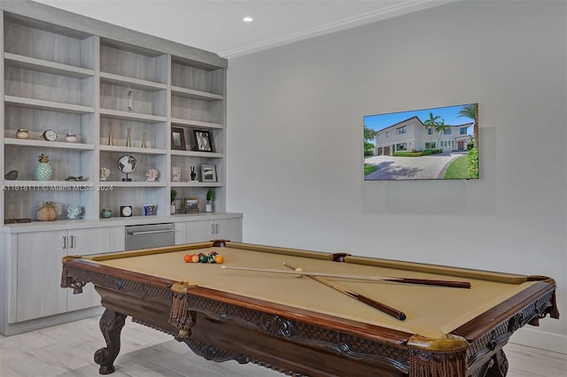 playroom with ornamental molding, pool table, and light hardwood / wood-style flooring