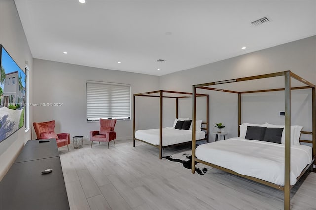 bedroom with light hardwood / wood-style floors