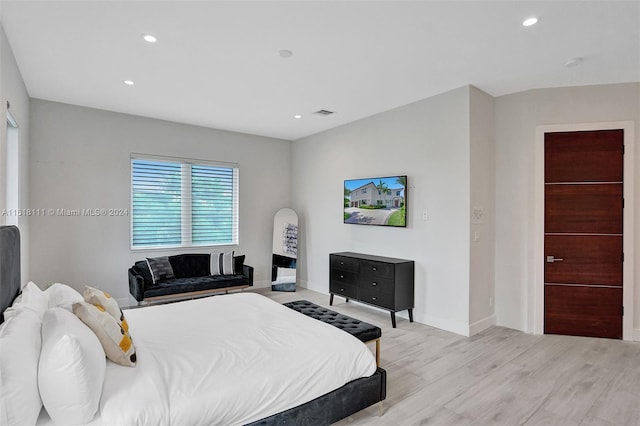 bedroom with light hardwood / wood-style flooring