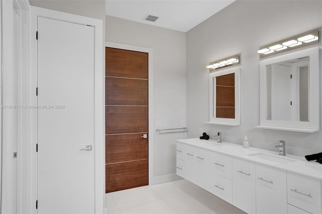 bathroom with vanity and tile patterned flooring