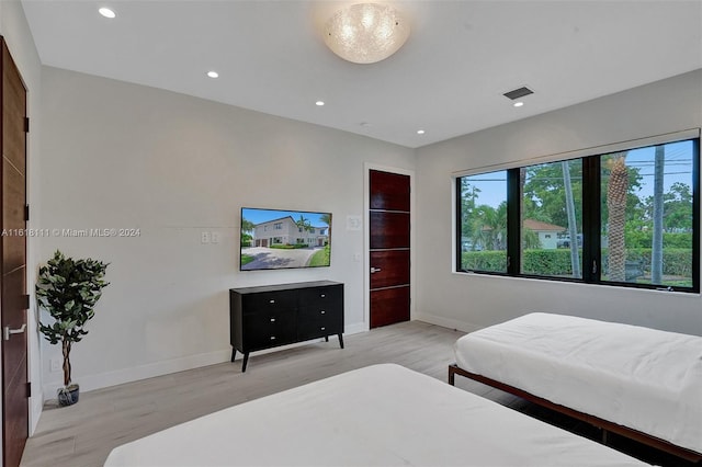 bedroom featuring light hardwood / wood-style flooring