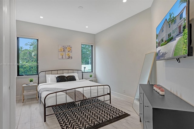 bedroom with light hardwood / wood-style flooring