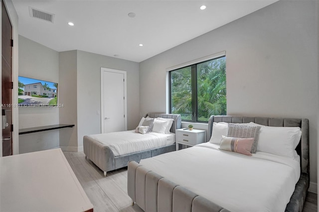 bedroom featuring light wood-type flooring