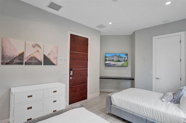 bedroom with light hardwood / wood-style floors