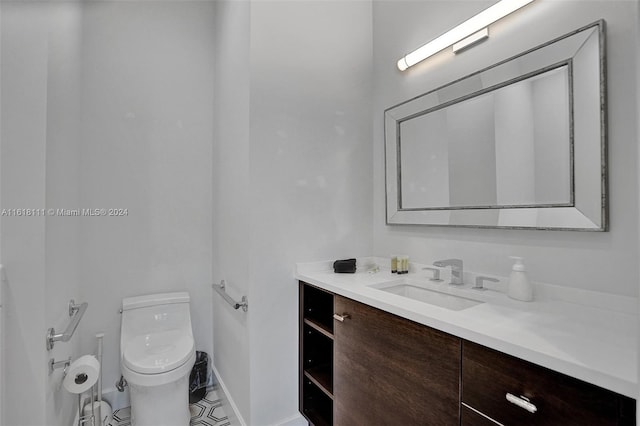 bathroom with vanity and toilet