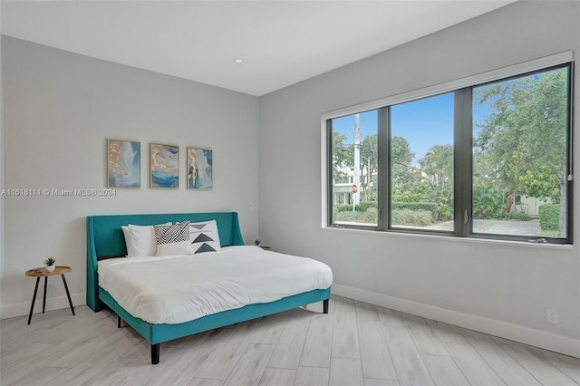 bedroom with light hardwood / wood-style flooring