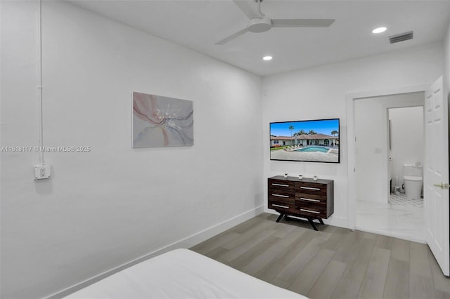 bedroom with ceiling fan and light hardwood / wood-style flooring