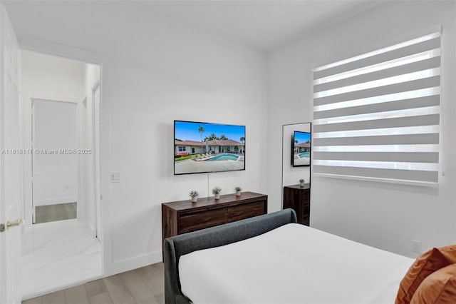 bedroom with light hardwood / wood-style floors