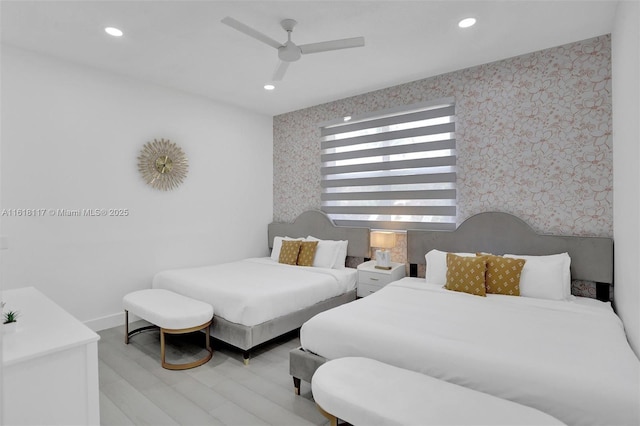 bedroom featuring ceiling fan and light hardwood / wood-style flooring