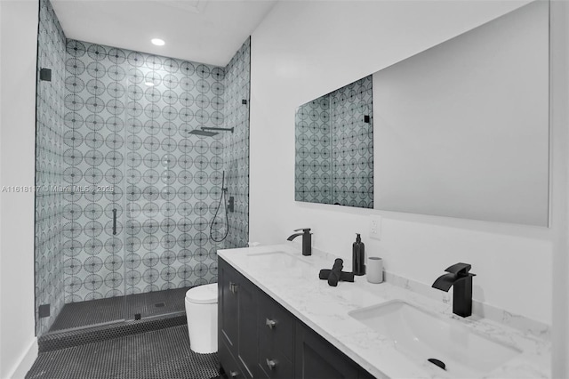 bathroom with walk in shower, vanity, toilet, and tile patterned flooring