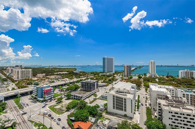 bird's eye view featuring a view of city and a water view